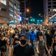 People walk down 7th street in Austin after a vigil for Garrett Foster on July 26, 2020 in downtown Austin, Texas. Garrett Foster, 28, who was armed and participating in a Black Lives Matter protest, was shot and killed after a chaotic altercation with a motorist who allegedly drove into the crowd. The suspect, who has yet to be identified, was taken into custody.